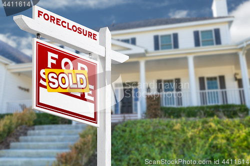 Image of Left Facing Foreclosure Sold For Sale Real Estate Sign in Front 