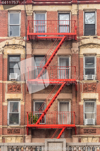 Image of Red fire escape of an apartment building in New York city