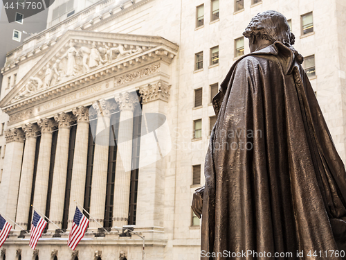 Image of View from Federal Hall of the statue of George Washington and the Stock Exchange building in Wall Street, New York City.