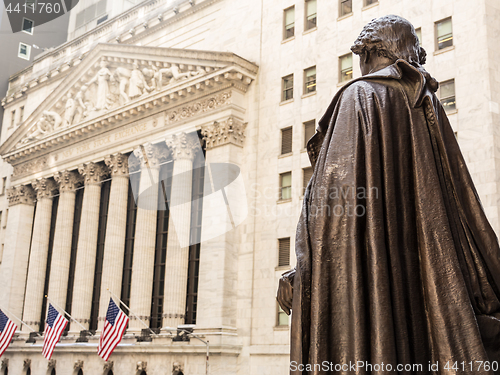 Image of View from Federal Hall of the statue of George Washington and the Stock Exchange building in Wall Street, New York City.