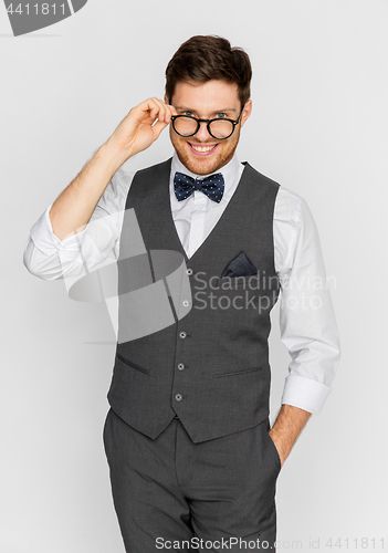 Image of happy man in festive suit and eyeglasses