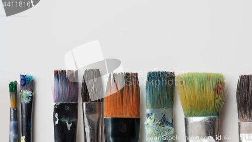 Image of dirty paintbrushes from top