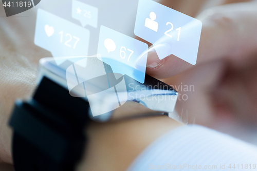 Image of close up of smart watch with social media icons