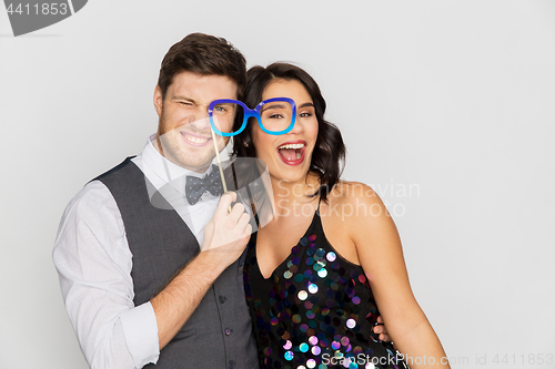 Image of happy couple with party glasses having fun
