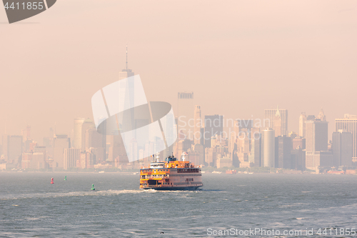 Image of Staten Island Ferry and Lower Manhattan Skyline, New York, USA.