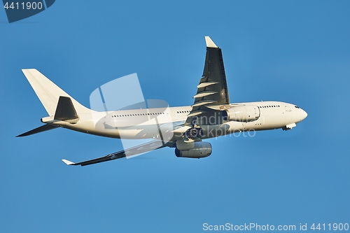 Image of Plane taking off against clear blue sky