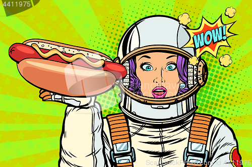 Image of Hungry woman astronaut with hot dog sausage