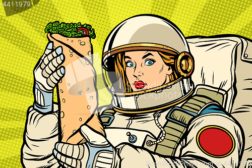Image of Hungry woman astronaut with Shawarma kebab