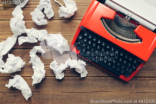 Image of Vintage typewriter on wooden background