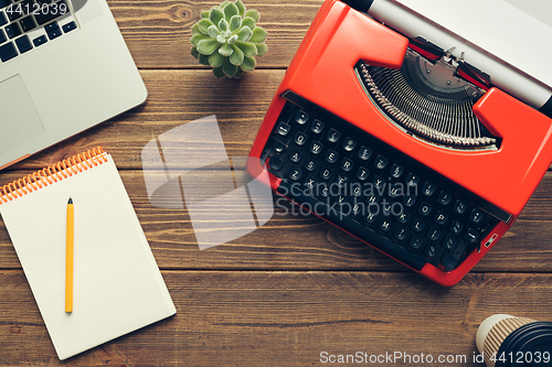 Image of Vintage typewriter on wooden background