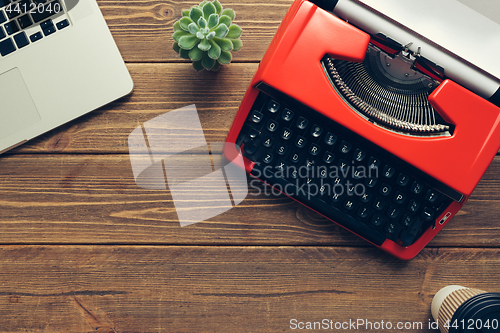 Image of Vintage typewriter on wooden background