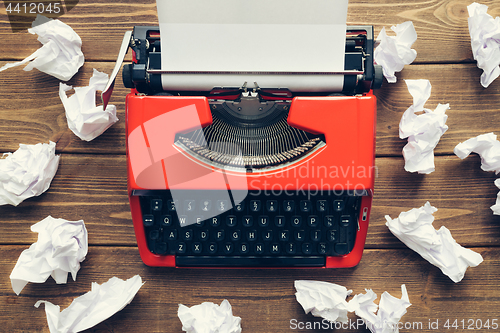 Image of Vintage typewriter on wooden background