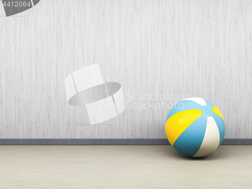 Image of single beach ball on the floor