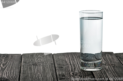 Image of Single glass of water on wooden table