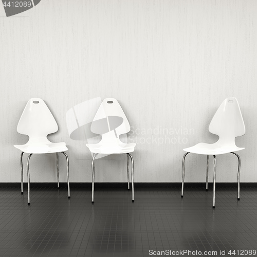 Image of three white chairs at a wall with space for your content