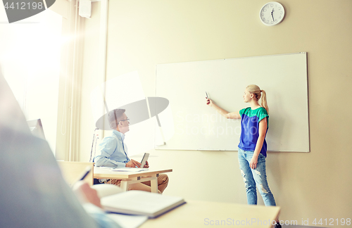Image of student girl at school white board and teacher