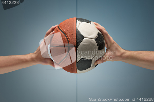 Image of Hands holding soccer ball