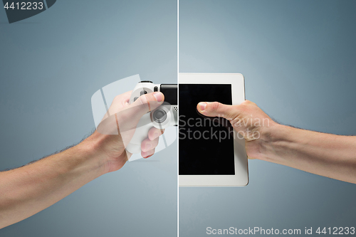 Image of male hand holding a laptop