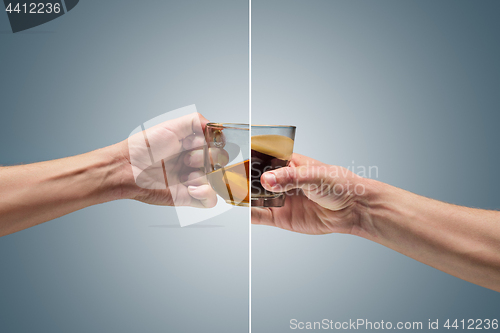 Image of Man holding a cup of coffee