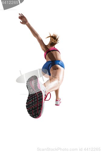 Image of The studio shot of high jump female athlete is in action