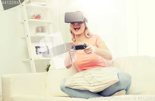 Image of woman in virtual reality headset with controller