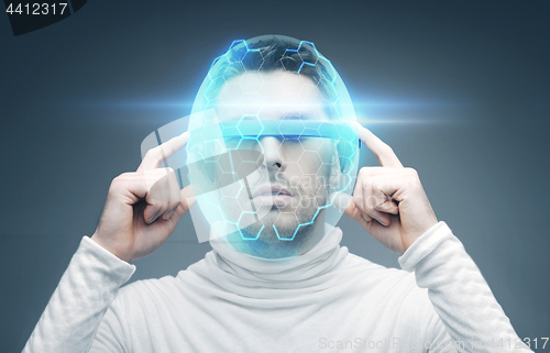 Image of man in 3d glasses and virtual helmet