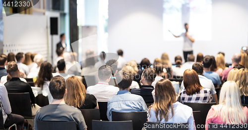 Image of Business speaker giving a talk at business conference event.