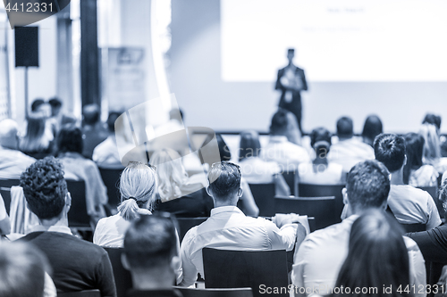 Image of Business speaker giving a talk at business conference event.