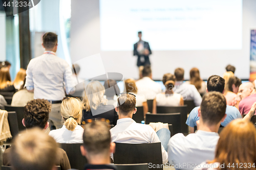 Image of Business speaker giving a talk at business conference event.