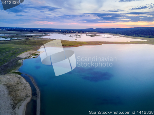 Image of Sunset views over the rural landscape and lake