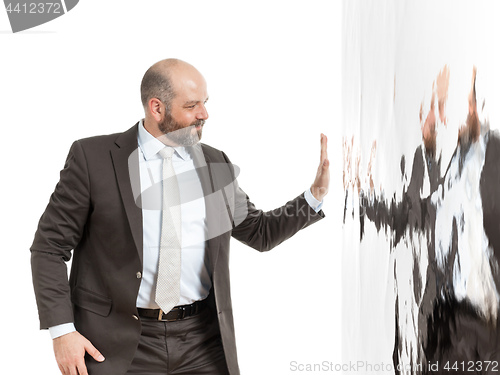 Image of business man at a wall of water