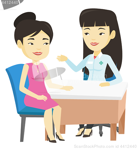 Image of Doctor consulting female patient in office.