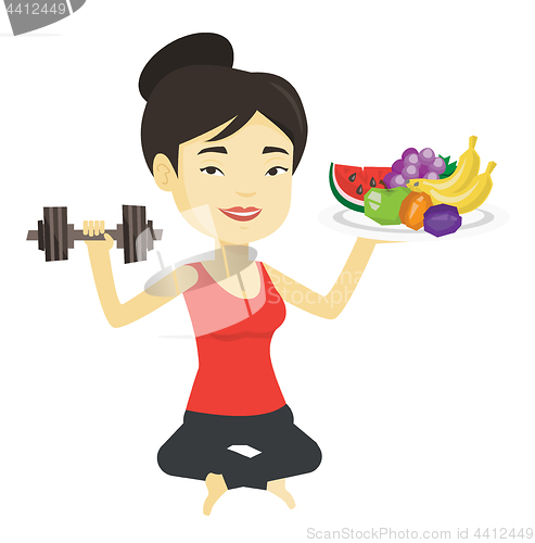 Image of Healthy woman with fruits and dumbbell.