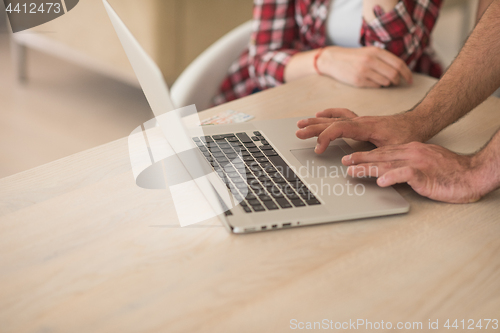 Image of happy young couple buying online