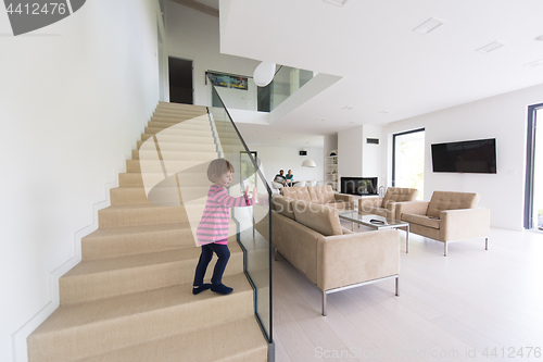 Image of family with little girl enjoys in the modern living room