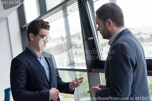 Image of cloasing the deal in modern office interior