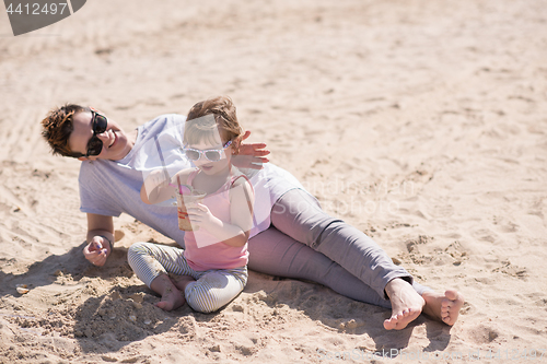 Image of Mom and daughter on the beach