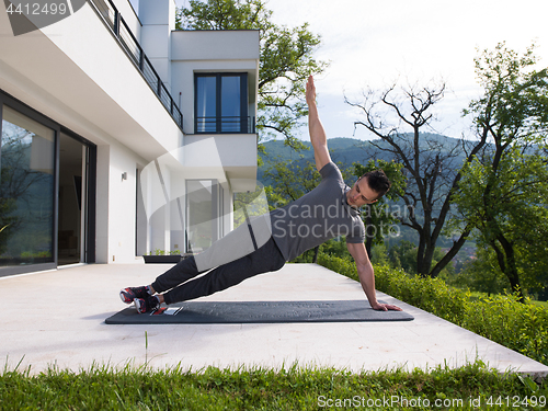 Image of man doing morning yoga exercises
