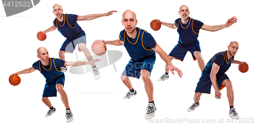 Image of Full length portrait of a basketball player with ball
