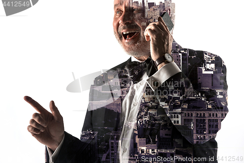 Image of Portrait of bearded businessman smiling. Double exposure city on the background.