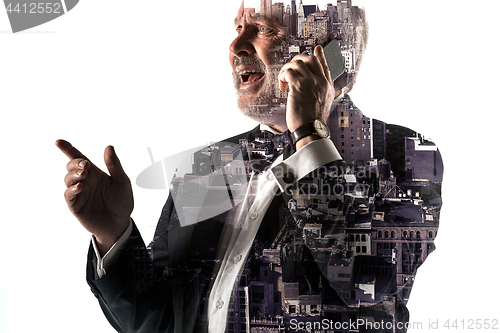 Image of Portrait of bearded businessman smiling. Double exposure city on the background.