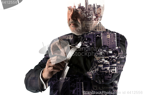 Image of Portrait of bearded businessman. Double exposure city on the background.