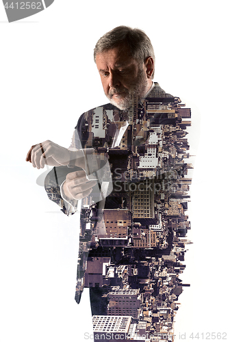 Image of Portrait of bearded businessman. Double exposure city on the background.