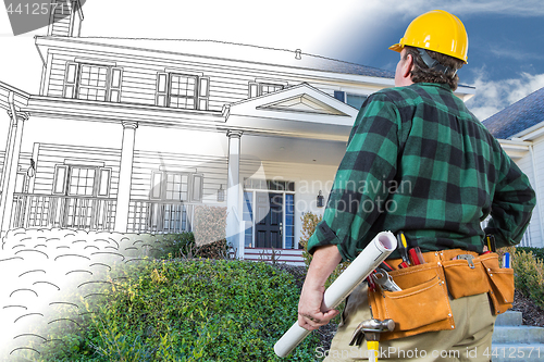 Image of Male Contractor with Hard Hat and Tool Belt Looking At Custom Ho