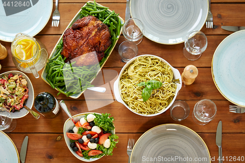 Image of various food on served wooden table