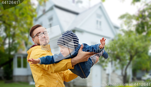 Image of father with son playing and having fun outdoors
