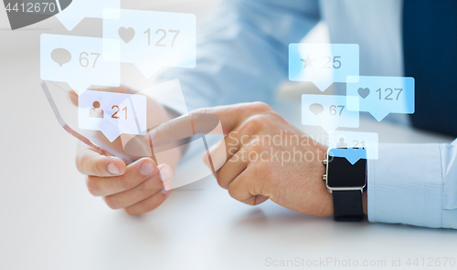 Image of hands with smartphone and smart watch social media