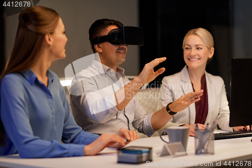 Image of team with virtual reality headset at office