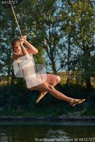 Image of Rope swing river jump