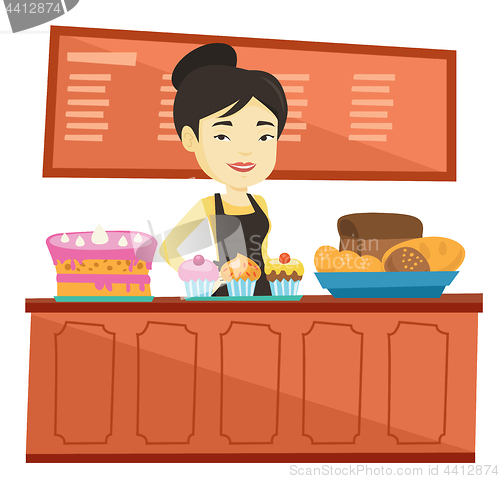 Image of Worker standing behind the counter at the bakery.